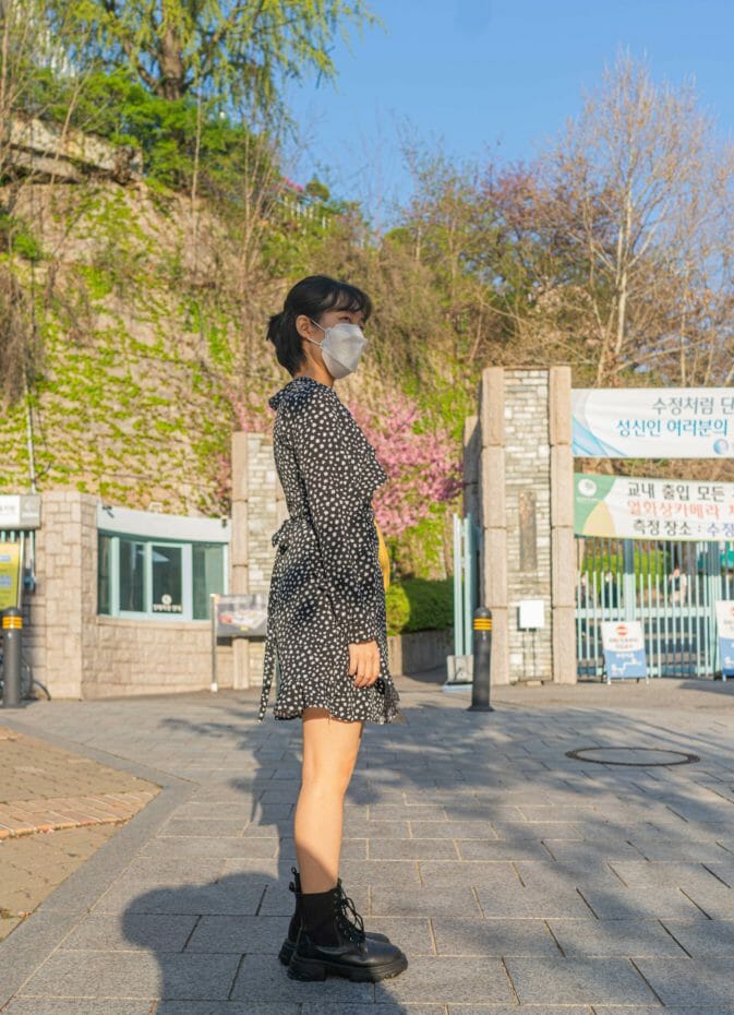 Top Korean Fashion Trends In 2023 45 Korean woman wearing military-style boots