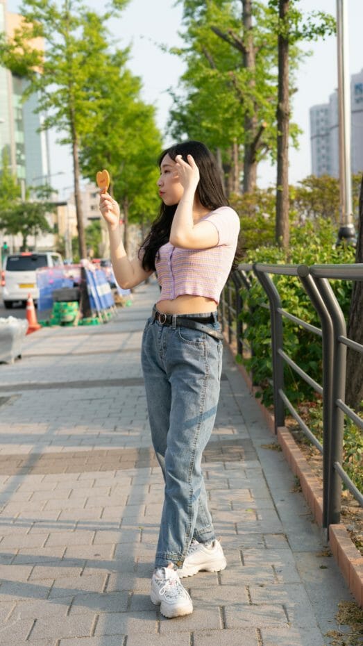 Top Korean Fashion Trends In 2023 43 Korean woman wearing chunky shoes, crop top and baggy jeans